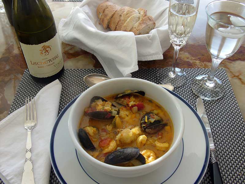 My easy gourmet Bouillabaisse served with crusty bread and a very chilled French Vouvray made from Chenin Blanc grapes grown along the Loire River.