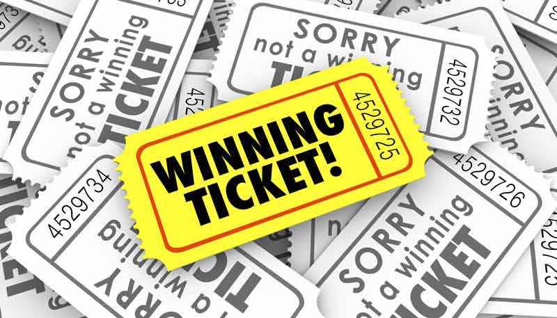 A winning ticket can be seen in yellow over a pile of losing tickets.