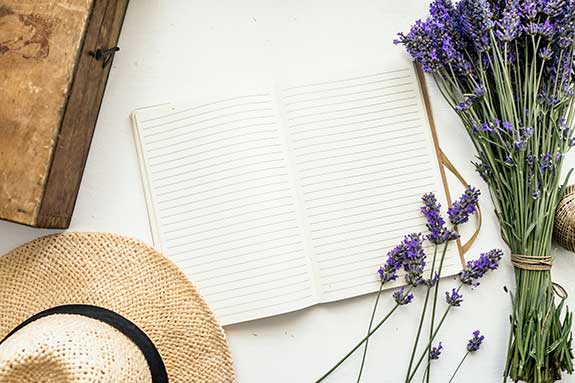 lavender cuttings beside an open journal book